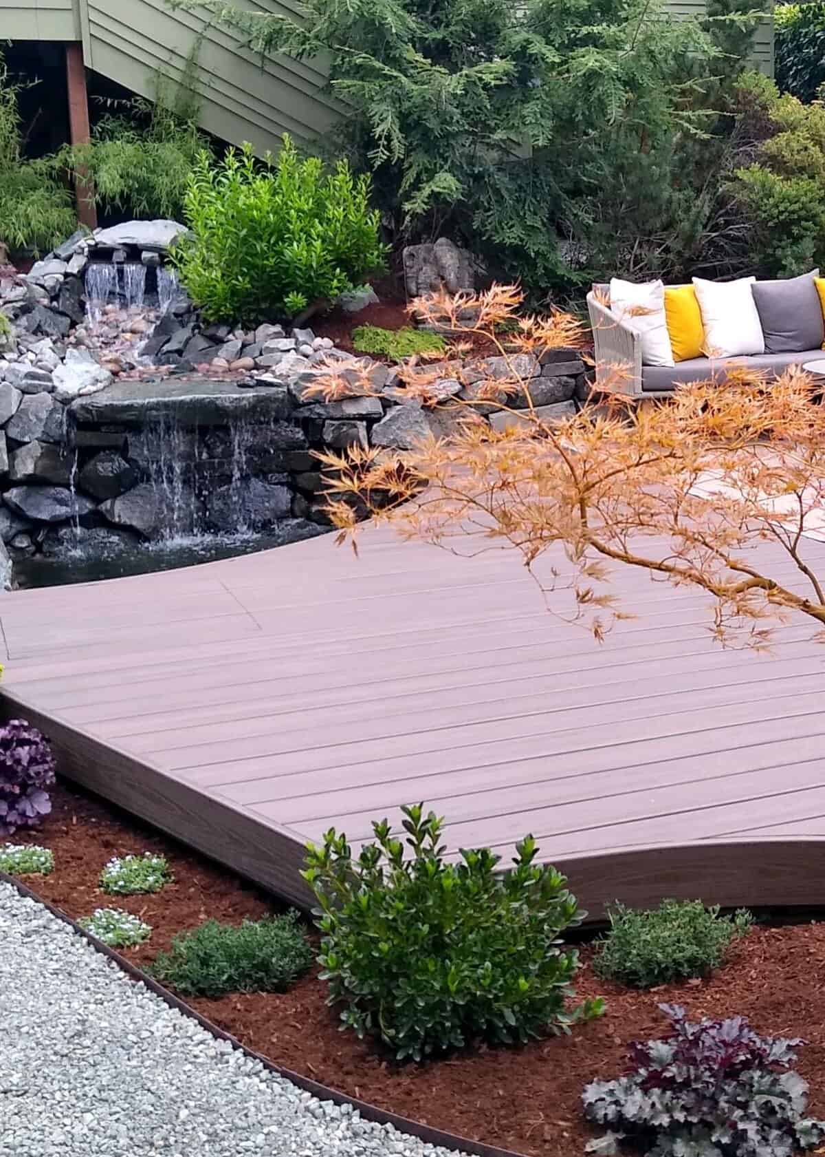 Custom outdoor carpentry — deck with integrated water feature